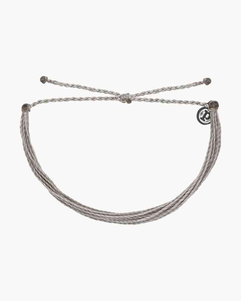 Handmade grey Pura Original bracelet, waterproof and unique. Elevate your style with this iconic accessory. Buy now for Pura Vida vibes!