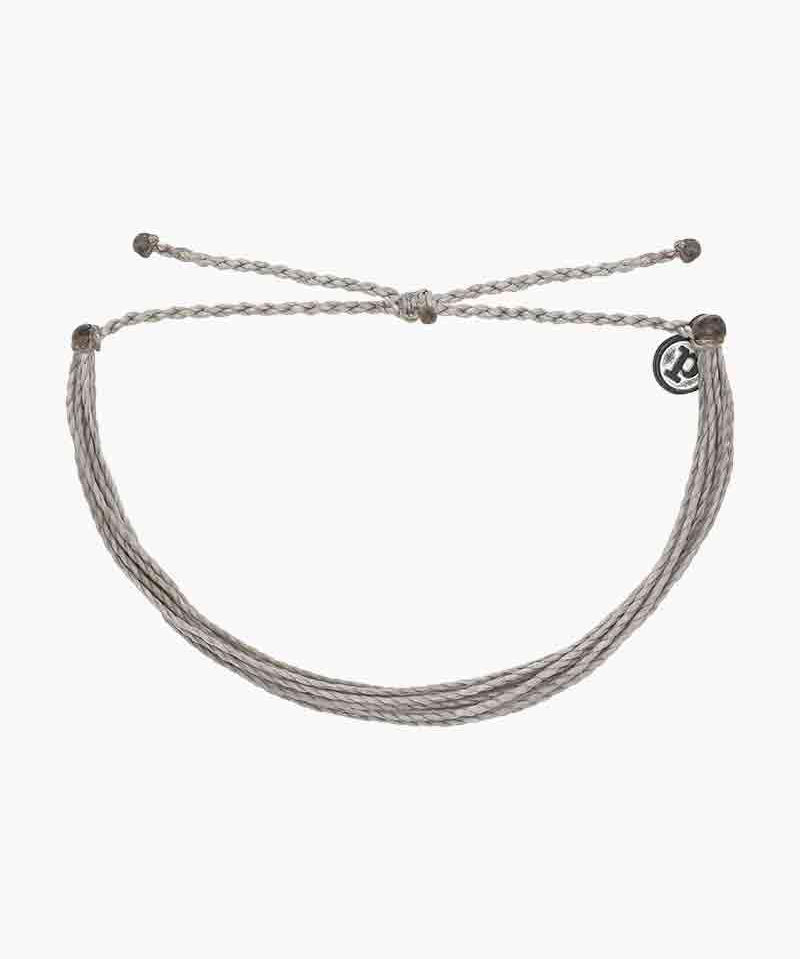 Handmade grey Pura Original bracelet, waterproof and unique. Elevate your style with this iconic accessory. Buy now for Pura Vida vibes!