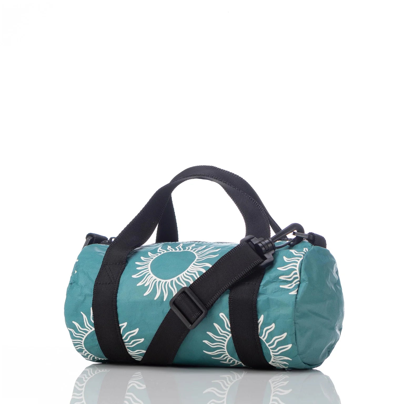 Sun Mini Mini Duffle Bag in Isle with adjustable strap, inside pocket, 4.5" diameter, and white interior - 9" long, 10" handles.