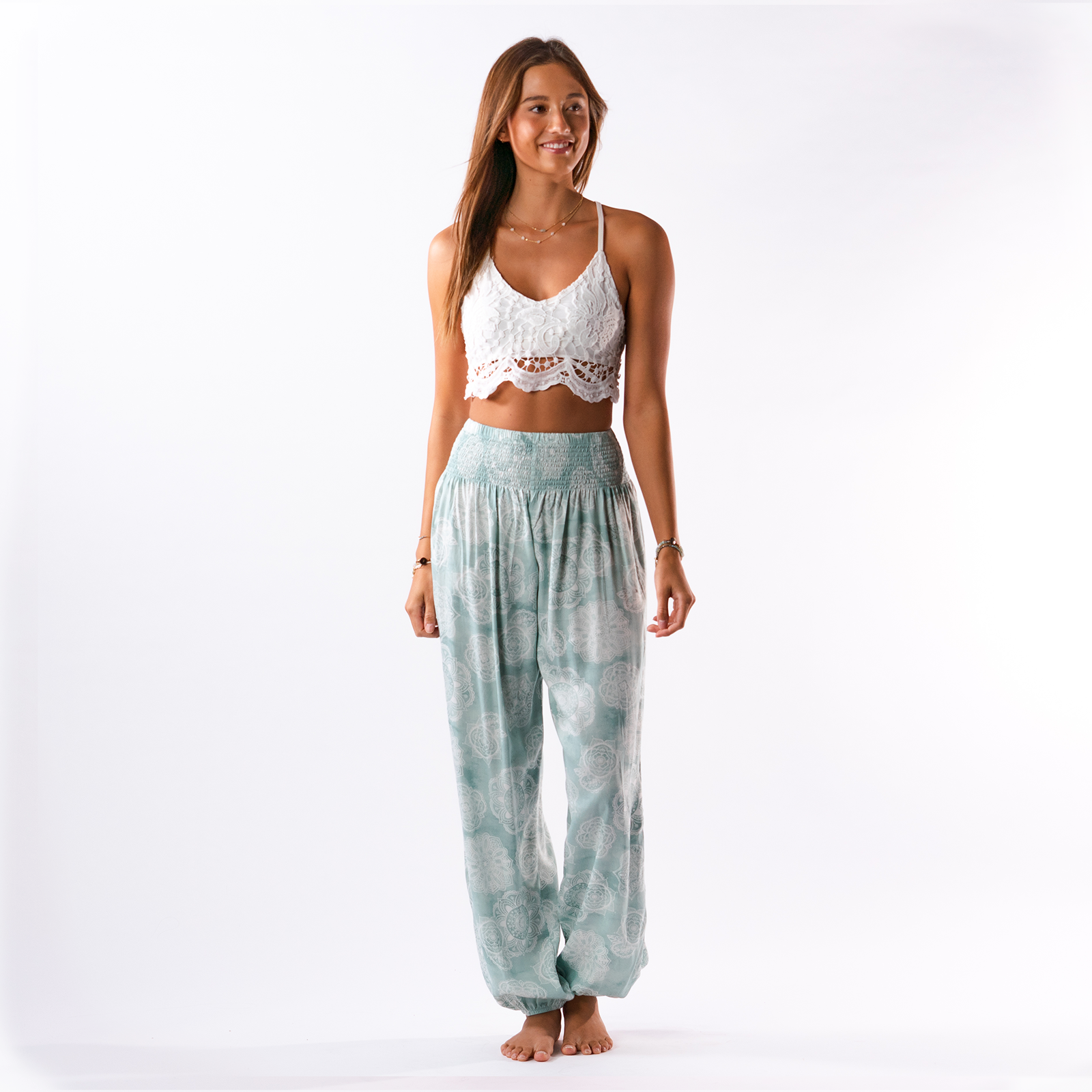 Lotus and Luna Sanibel Harem Pants in Sage Green Lace Mandala. Soft, lightweight lounge pants perfect for yoga, beach, or casual wear. Elastic waist and cinched leg for comfort and style.